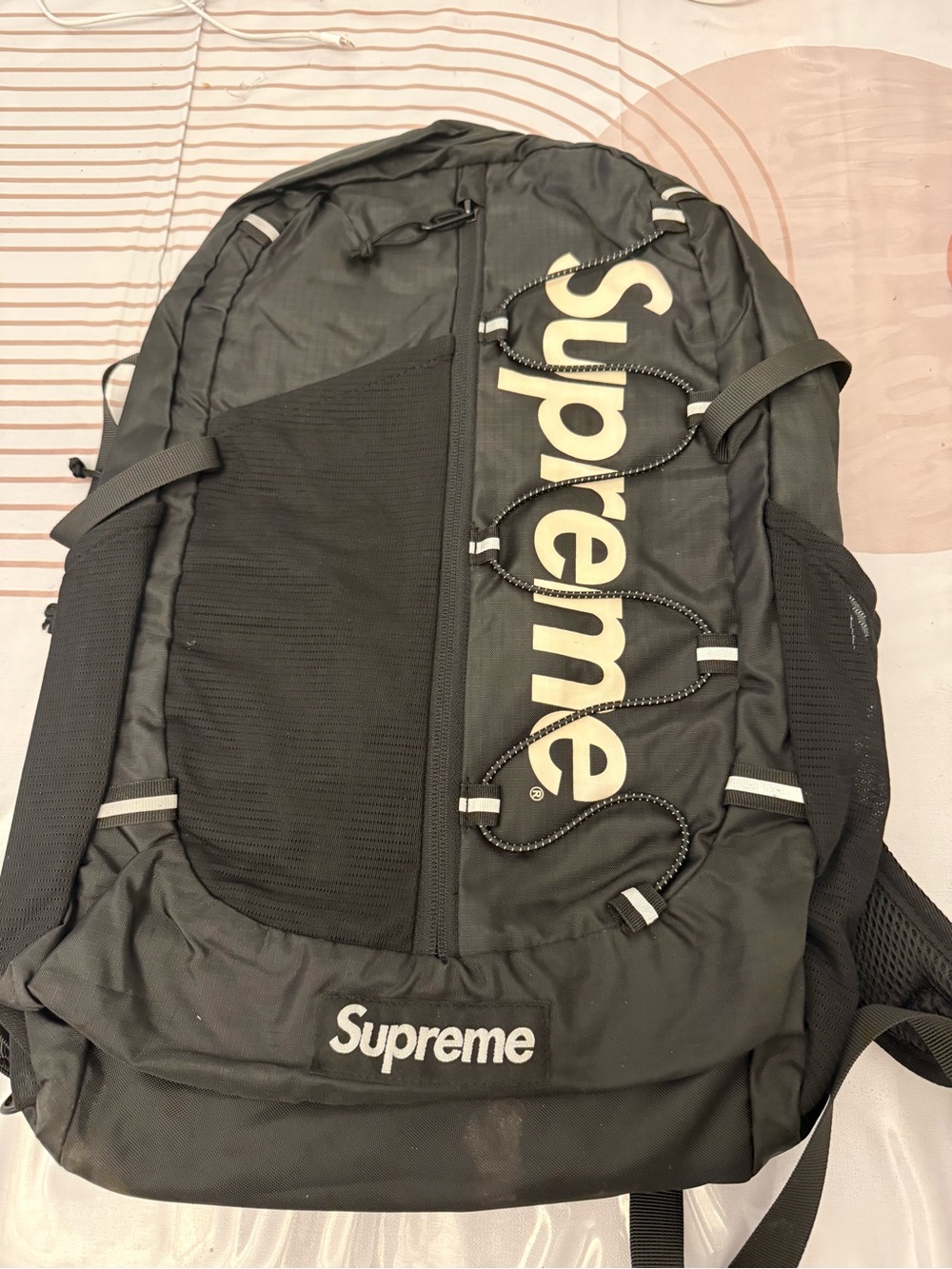 Supreme Black Backpack with White Logo and Bungee Cord